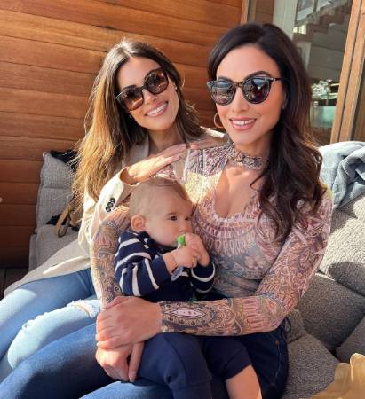 Crystal Marie Denha and her sister with their brother, Chris' kid. 